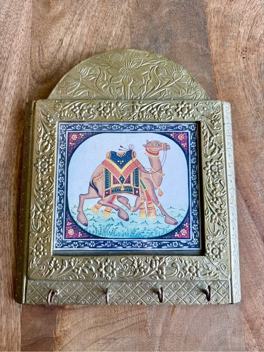 Indian brass-trimmed wall key holder featuring an ornate, miniature-style camel